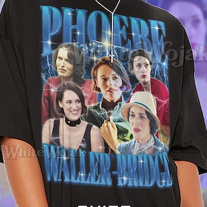 May include: Black unisex t-shirt featuring a graphic of Phoebe Waller-Bridge with the text "PHOEBE WALLER-BRIDGE". The shirt has a crew neck and short sleeves. The text "SHIRT Unisex" is also printed on the shirt.