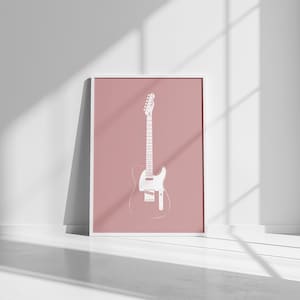 Puede incluir: Una impresión enmarcada que presenta un contorno blanco de una guitarra eléctrica sobre un fondo rosa empolvado. La guitarra se representa en un estilo minimalista, centrándose en su forma. La impresión se muestra en un marco blanco.