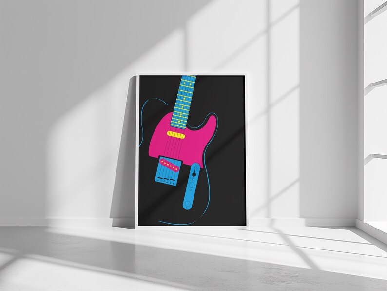 May include: A framed art print featuring a stylized electric guitar illustration. The guitar has a pink body, a blue neck, and a yellow pickup. The background is black, and the artwork is set against a white wall.