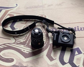 Câmera DSLR em miniatura na escala 1/6 com lentes/fotografia