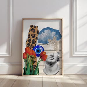 May include: A framed art print featuring a collage of diverse elements. It includes a leopard print, a blue eye, orange tulips, a cloud, and a bust of a classical statue. The artwork is set against a white background and a wooden frame.