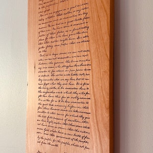 May include: A wooden plaque with the Gettysburg Address engraved in cursive script. The text includes the date "November 19, 1863" and the signature "Abraham Lincoln".