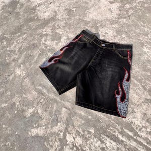y2k shorts
flame shorts
rhinestone shorts
baggy jorts
streetwear shorts
skater shorts
black denim shorts
y2k fashion
flame jorts
hip hop shorts
mens jorts
womens jorts
oversized shorts