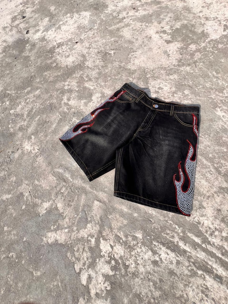 y2k shorts
flame shorts
rhinestone shorts
baggy jorts
streetwear shorts
skater shorts
black denim shorts
y2k fashion
flame jorts
hip hop shorts
mens jorts
womens jorts
oversized shorts