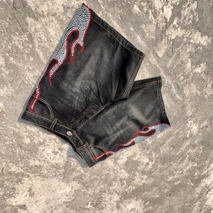 y2k shorts
flame shorts
rhinestone shorts
baggy jorts
streetwear shorts
skater shorts
black denim shorts
y2k fashion
flame jorts
hip hop shorts
mens jorts
womens jorts
oversized shorts
