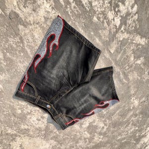 y2k shorts
flame shorts
rhinestone shorts
baggy jorts
streetwear shorts
skater shorts
black denim shorts
y2k fashion
flame jorts
hip hop shorts
mens jorts
womens jorts
oversized shorts
