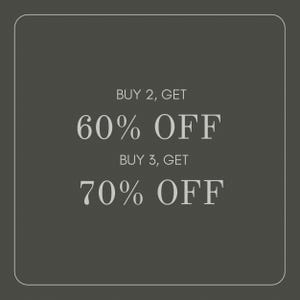 May include: A dark gray square graphic with rounded corners featuring white text that reads: BUY 2, GET 60% OFF and BUY 3, GET 70% OFF. The design uses a clean, centered layout with a thin white border framing the entire promotional announcement.