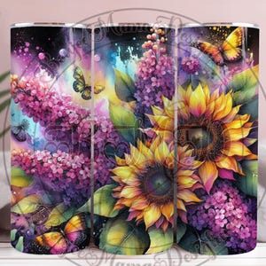 May include: A floral tumbler featuring a vibrant watercolor design. The tumbler showcases sunflowers, purple lilacs, and butterflies in shades of yellow, purple, and orange. The design is set against a dark, speckled background.