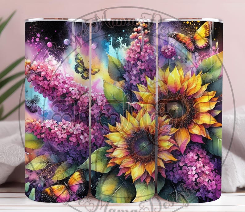 May include: A floral tumbler featuring a vibrant watercolor design. The tumbler showcases sunflowers, purple lilacs, and butterflies in shades of yellow, purple, and orange. The design is set against a dark, speckled background.