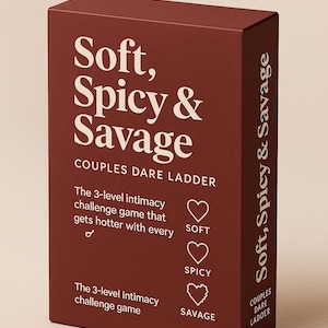 May include: A maroon box with the text "Soft, Spicy & Savage" in white. The box is for a couples dare game, with the words "Couples Dare Ladder" and "The 3-level intimacy challenge game" also in white.