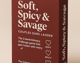 May include: A maroon box with the text "Soft, Spicy & Savage" in white. The box is for a couples dare game, with the words "Couples Dare Ladder" and "The 3-level intimacy challenge game" also in white.