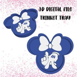 May include: Two blue trinket trays shaped like a mouse head, featuring a white bow and white gloved hands. The text "3D DIGITAL FILE TRINKET TRAY" is above the trays.