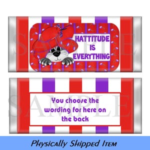 May include: Red and white candy bar wrapper with a purple and white striped border. The wrapper features a cartoon animal wearing a red hat and the text "HATTITUDE IS EVERYTHING". The bottom of the wrapper says "You choose the wording for here on the back".