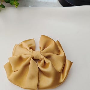 set of 2  oversized satin triple layer and long tail bows.