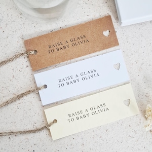Personalised Cut Out Heart Baby Shower Tags, Raise A Glass Tags, Simple Modern Gift Tags, Kraft, White, Cream Hammered, Size Long 2.5x7cm