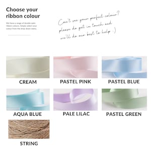 May include: A selection of ribbon colors for gift wrapping, including cream, pastel pink, pastel blue, aqua blue, pale lilac, pastel green, and string.
