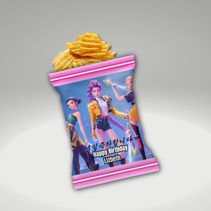 May include: A bag of ruffled potato chips with a pink and blue graphic design. The bag features three animated figures and the text "Happy Birthday Lizbeth" in English and Korean. The chips are golden yellow and visible at the top of the bag.