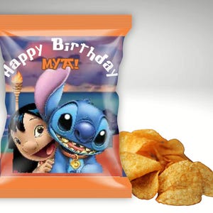 May include: An orange chip bag with the text "Happy Birthday MYA!" features a blue cartoon character and a girl. A pile of golden potato chips sits to the right of the bag.