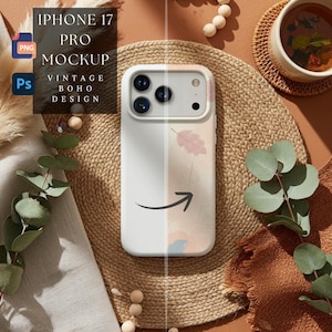 以下が含まれることがあります： ヴィンテージボヘミアンデザインの白いiPhone 17 Proモックアップケース。ケースは黒い矢印のフローラルパターンが特徴です。画像には「IPHONE 17 PRO MOCKUP VINTAGE BOHO DESIGN」というテキストが含まれています。