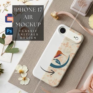 May include: White iPhone 17 Air Mockup with a floral design and a graphic of a bird and a crescent moon. The phone is on a neutral-toned surface with flowers and a ring.