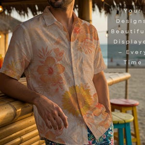May include: A light beige button-down shirt with a floral pattern in shades of orange and yellow. The shirt is worn by a person leaning on a bamboo bar. The text on the right says "Your Designs, Beautifully Displayed - Every Time."