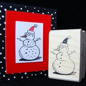 little snowman with glasses