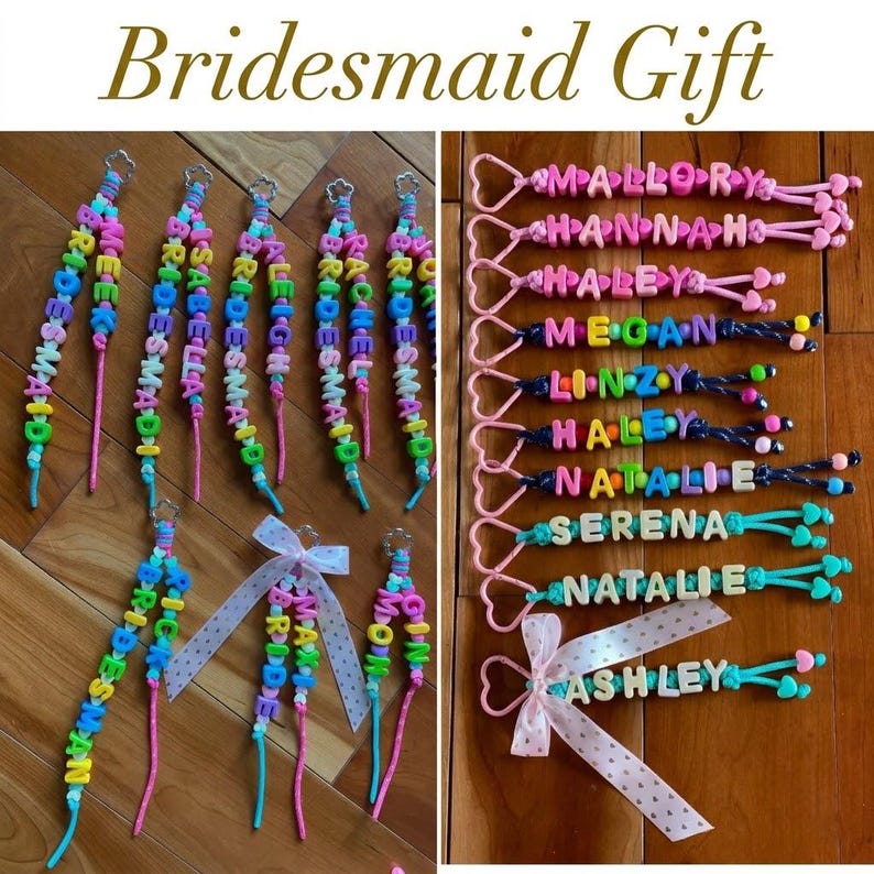 May include: A collection of personalised keychains featuring colourful plastic letter beads spelling names like Mallory, Hannah, Haley, Megan, Linzy, Serena, Natalie, and Ashley, attached to heart-shaped clasps with some accented by polka-dot ribbons.
