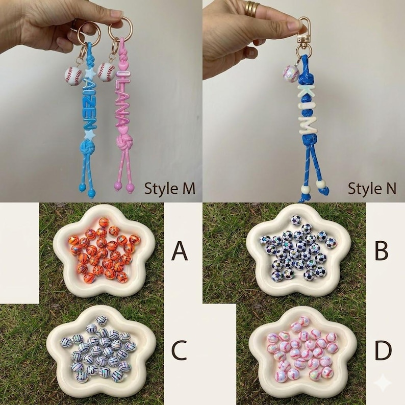 May include: Customisable keychains featuring baseball charms and letter beads spelling AIZEN, LANA, or KIM, alongside four star-shaped dishes containing small spherical beads with orange, football, volleyball, and pink marble patterns.
