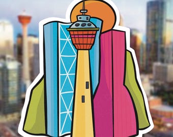 May include: A sticker illustration featuring a yellow tower with a red and orange observation deck, flanked by a blue building with a white grid pattern and a pink building, all set against a large orange sun and green shapes.