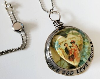 Love God love people, hand forged bezel wire wrapped in sterling silver.
