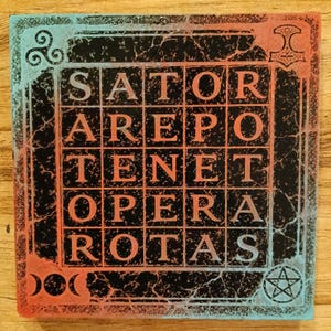 May include: Square coaster with the text "SATOR AREPO TENET OPERA ROTAS" in a grid, with a distressed black background and red and blue accents. Features symbols like a hammer, pentagram, and triskelion.
