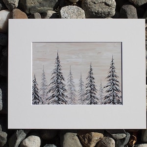 May include: An original painting of a forest scene featuring tall evergreen trees in shades of grey and white. The artwork is framed in a white mount and set against a neutral background. The painting evokes a sense of calm and natural beauty.