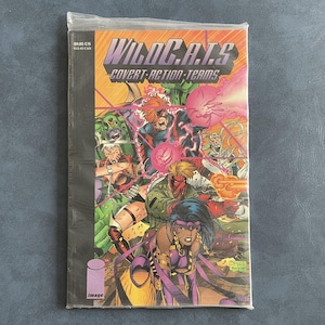 May include: A sealed comic book titled "WildC.A.T.s Covert Action Teams." The cover features a vibrant illustration of several costumed characters in action, with a dynamic composition and bold colors. The Image Comics logo is visible.