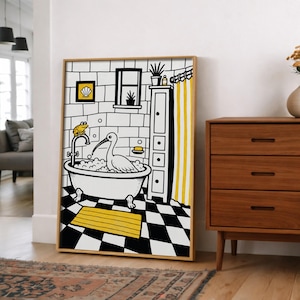 May include: A framed wall art print featuring a black and white line drawing of a bathroom scene with a yellow rug, yellow shower curtain, and yellow accents. A white bird sits in a clawfoot bathtub filled with bubbles, while a small frog sits on the faucet.