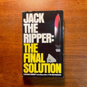 May include: A book cover with the title "JACK THE RIPPER: THE FINAL SOLUTION" in white and yellow text on a black background. A knife with a red blade is depicted. The author's name, Stephen Knight, is also visible.