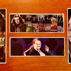 May include: A collection of four book covers featuring the author Shirley Jackson. The covers are for the books "The Lottery", "The Haunting of Hill House", "We Have Always Lived in the Castle", and "The Adventures of the Demon Lover".