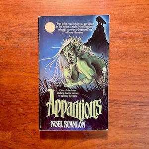 May include: A vintage paperback book titled "Apparitions" by Noel Scanlon. The cover features a green monster with long white hair, a full moon, and a dark silhouette. The book has quotes from Harry Harrison.