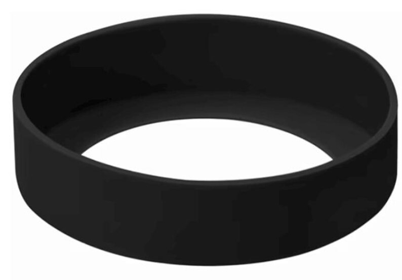 May include: A solid black silicone ring, circular in shape. The band is thick and has a smooth, matte finish. The object is a simple, minimalist design, suitable for various uses.