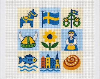 Könnte beinhalten: Ein quadratisches Stickbild mit einem Raster aus neun farbenfrohen Symbolen, darunter ein blaues Dala-Pferd, die schwedische Flagge, ein Maibaum, ein gehörnter Helm, eine gelbe Blume, eine Person in Tracht, ein Fisch, Stadtgebäude und eine Zimtschnecke.