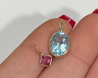 Very Brilliant Oval Blue Topaz in Solid 14K Yellow Gold Bezeled Pendant