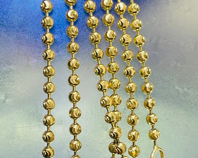 thumbnail interactive-video image 1 of Nuragold 10K Solid Yellow Gold 2mm Moon Cut Diamond Bead Ball Chain - Unisex, 16-30 Inch, Lobster Clasp, Made In Italy 1 of 3