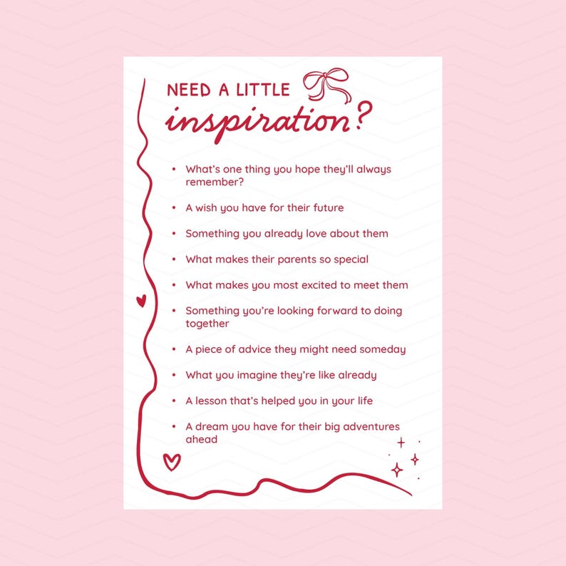 May include: A white card with the text "NEED A LITTLE inspiration?" in a handwritten style. Below, a list of prompts includes questions about memories, wishes, and advice. The card has a pink border with hearts and stars.