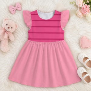 May include: A sleeveless dress featuring a bodice with horizontal stripes in two shades of pink and a solid light pink gathered skirt. The dress has ruffled cap sleeves and a round neckline. The design is simple, focusing on the color contrast.