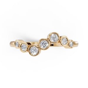 May include: A gold ring with seven round, clear gemstones set in individual bezels. The ring has a curved design, with the gemstones arranged in a wave-like pattern. The ring is set against a white background.