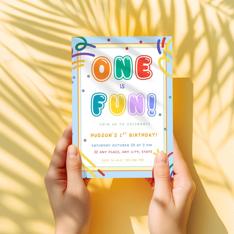 May include: A rectangular birthday invitation card featuring the colorful text ONE IS FUN! with additional details including Hudson's 1st birthday, date, time, location, and RSVP information. The design includes confetti and streamer graphics.