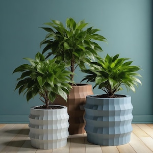 May include: Three decorative planters with green plants. The planters are in shades of light blue, brown, and white. The planters have a geometric, ridged design. The plants have lush green leaves and are potted in dark soil. The background is a solid teal color.