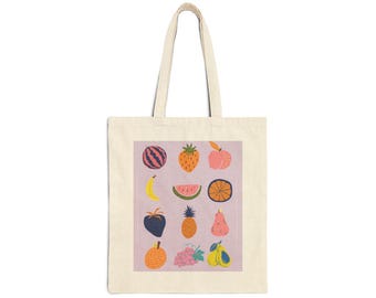 May include: A cream-colored tote bag with a rectangular design featuring colorful illustrations of various fruits, including a watermelon, strawberry, and orange. The fruits are set against a light purple background.