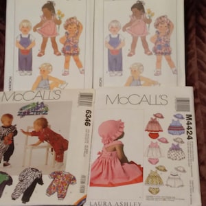 May include: Four sewing pattern envelopes labeled Simplicity 9233, McCall's 6346, and McCall's M4424, featuring illustrations of children's clothing including dresses, overalls, and rompers, with the text Lot: 2026 printed across the top of the image.
