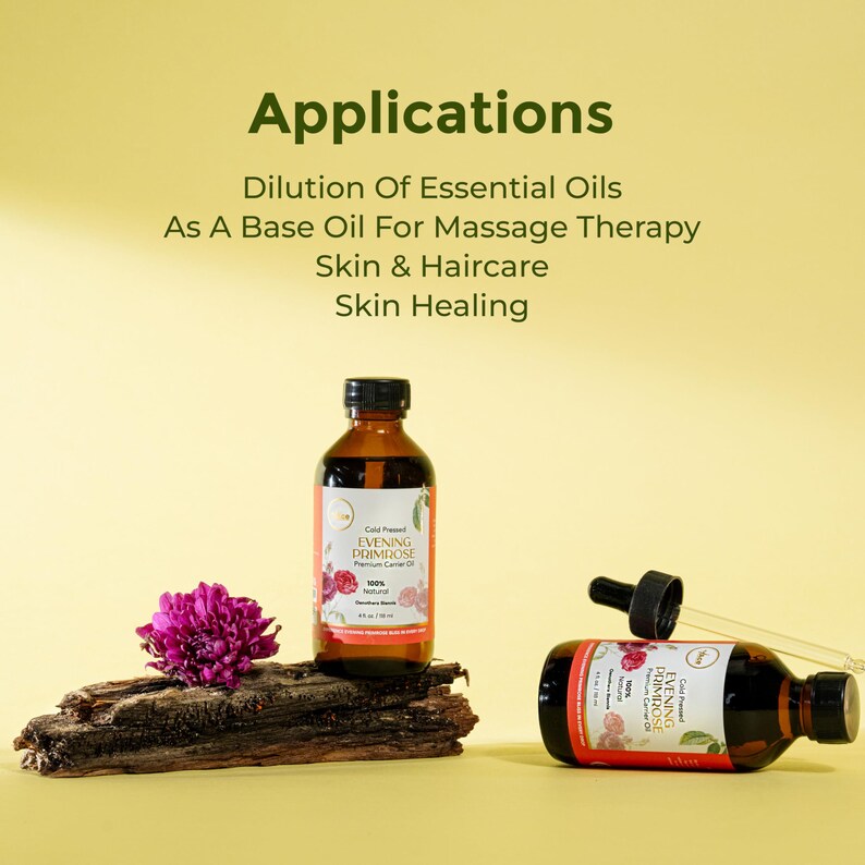 Puede incluir: Dos botellas de vidrio &aacute;mbar de aceite de onagra, una vertical y otra horizontal con un cuentagotas. Una flor morada y un trozo de madera en primer plano. El texto en la imagen dice "Applications" y "Skin & Haircare".