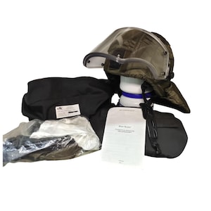 May include: An olive green helmet with a clear visor, part of a protective gear set. The set includes black bags, a white neck support with a blue band, and a document. The items are arranged on a white background.